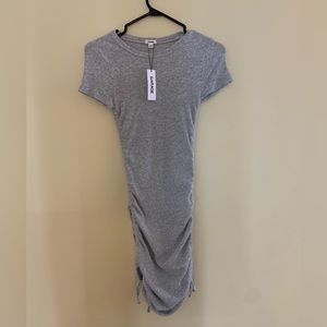 Simple gray dress. Never worn. Size “XS”. Stretchy, could be a “S” too.